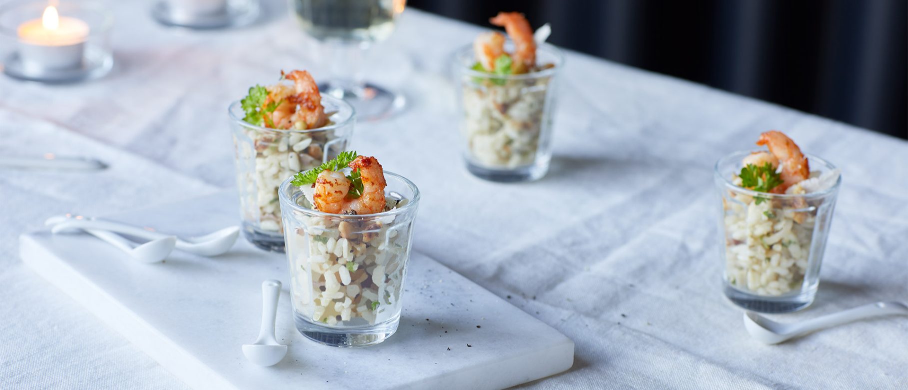 Häppchen mit Risotto und Champagner